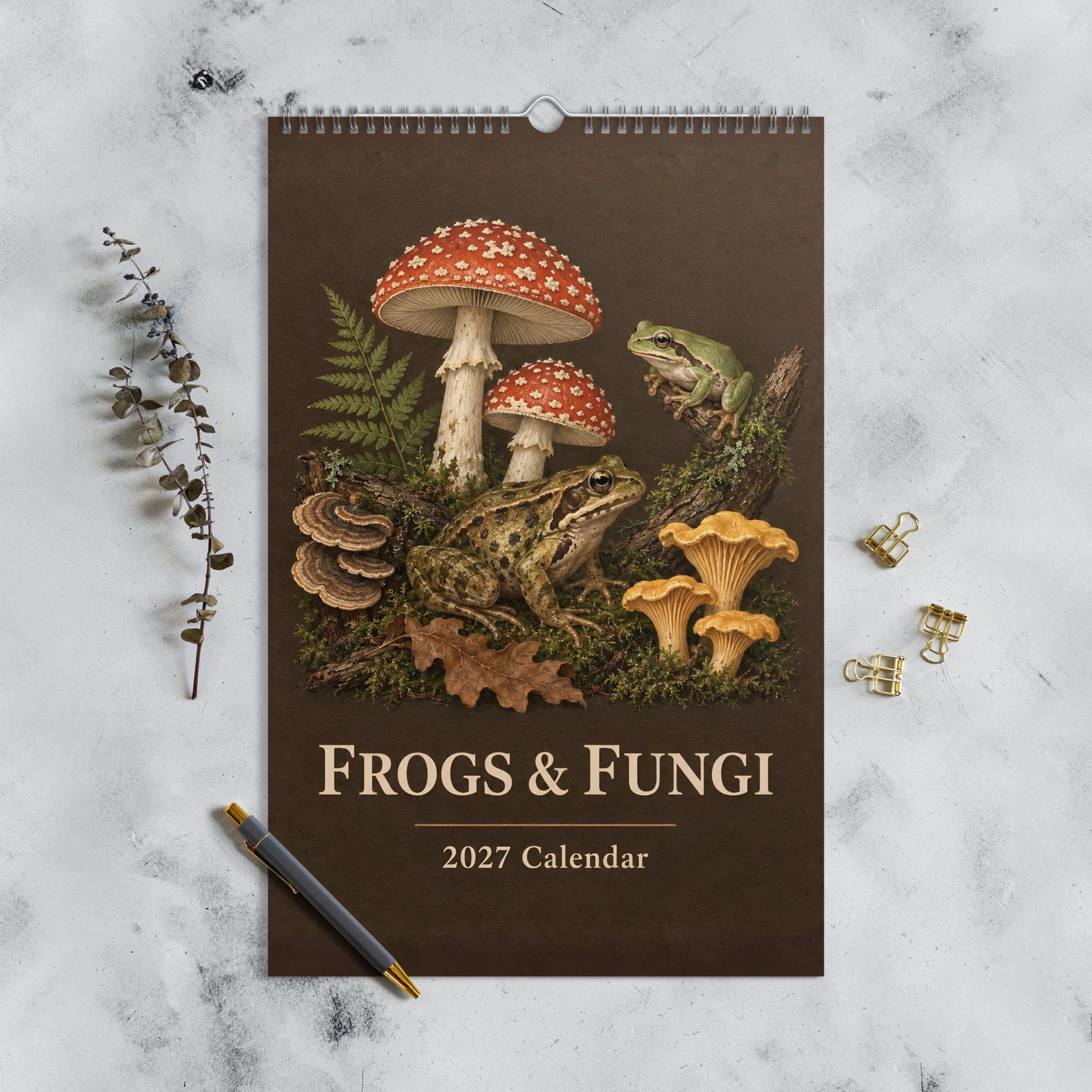 Frogs & Fungi 2027 calendar cover with two frogs and woodland mushrooms on a dark vintage-style background.